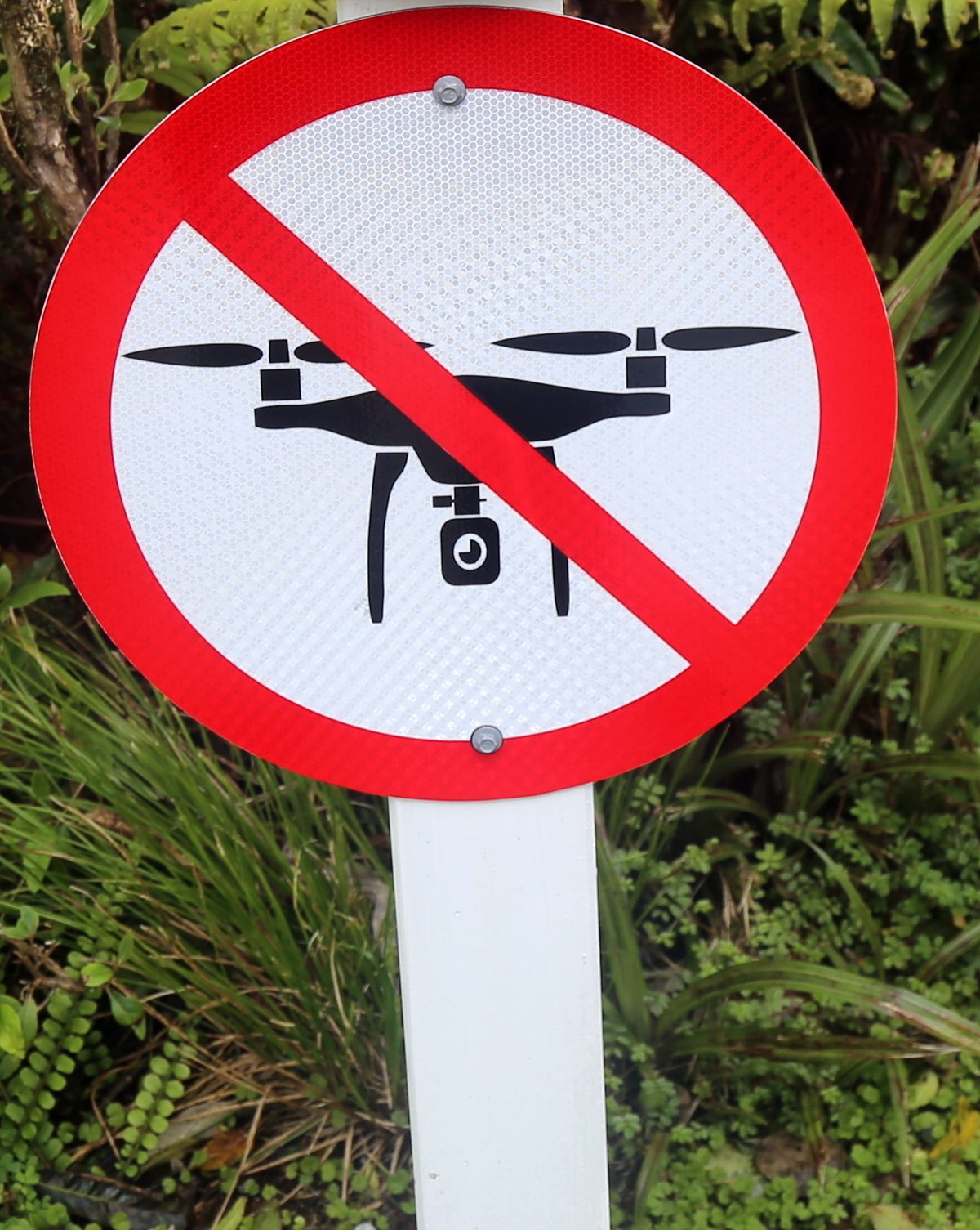 A round no-drones sign