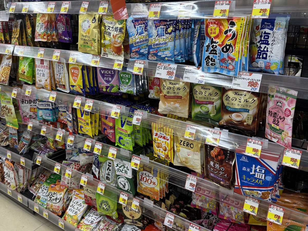 A wall of hard candy and throat drop bags in many flavors, from salt and plum to milk, honey and matcha
