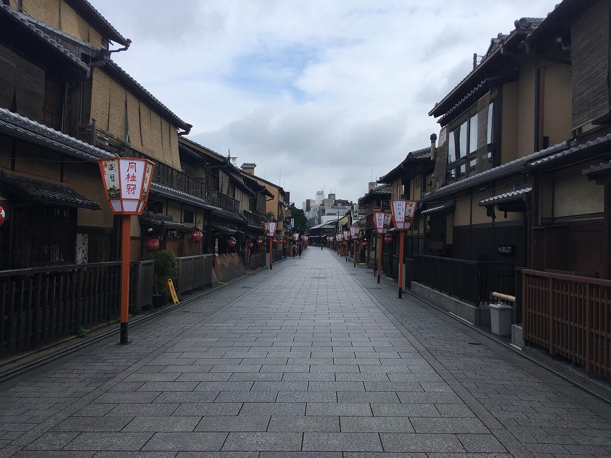 Hanamikoji-dori, a wide stone-paved street lined with wooden teahouses