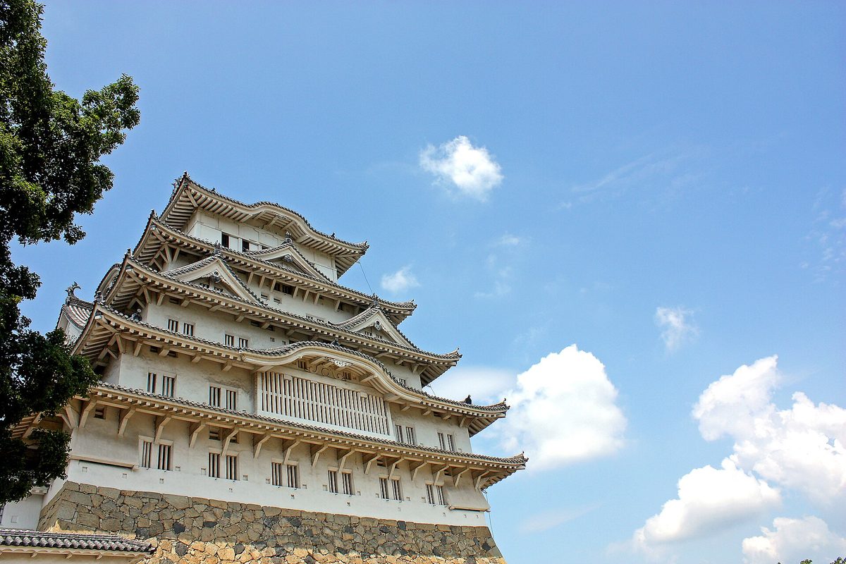 The white main keep of Himeji Castle, Himeji (Hyogo), under a blue sky