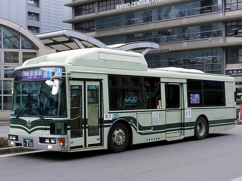 A light green city bus in Kyoto (Kyoto) at a bus terminal