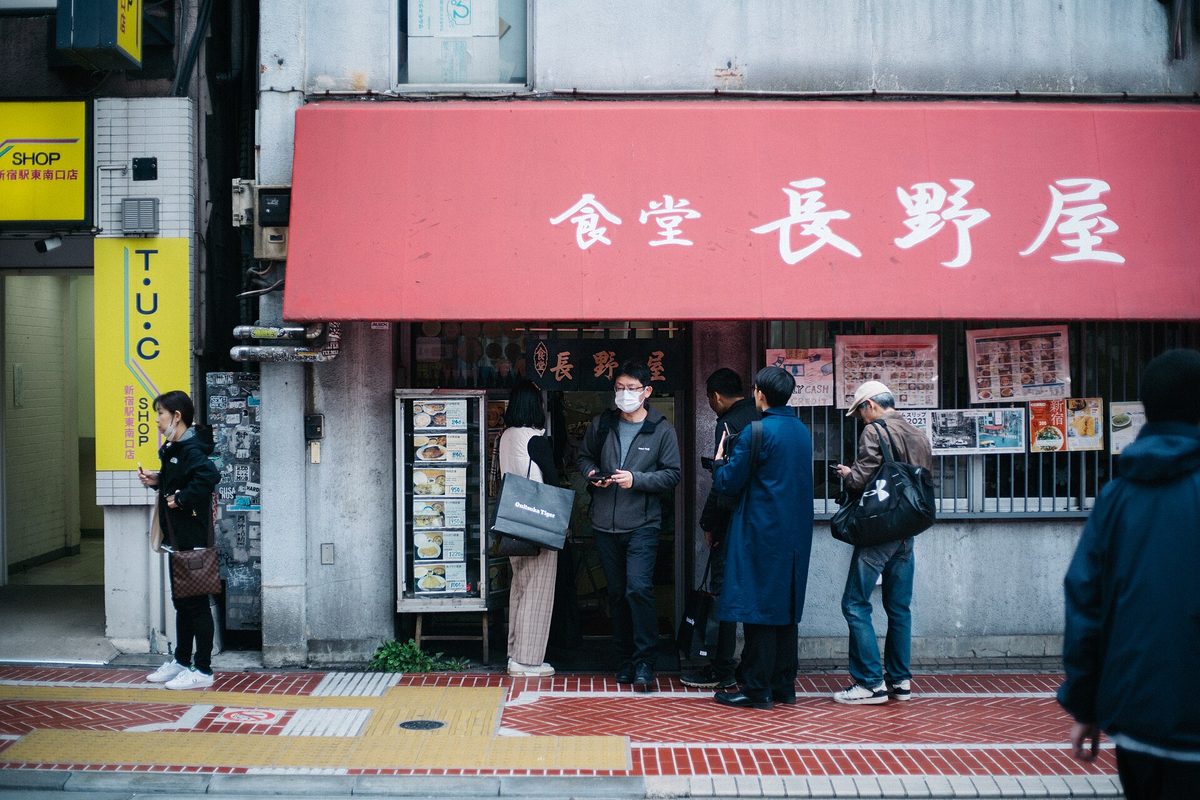 People waiting in line outside a small set-meal restaurant in Shinjuku (Tokyo)