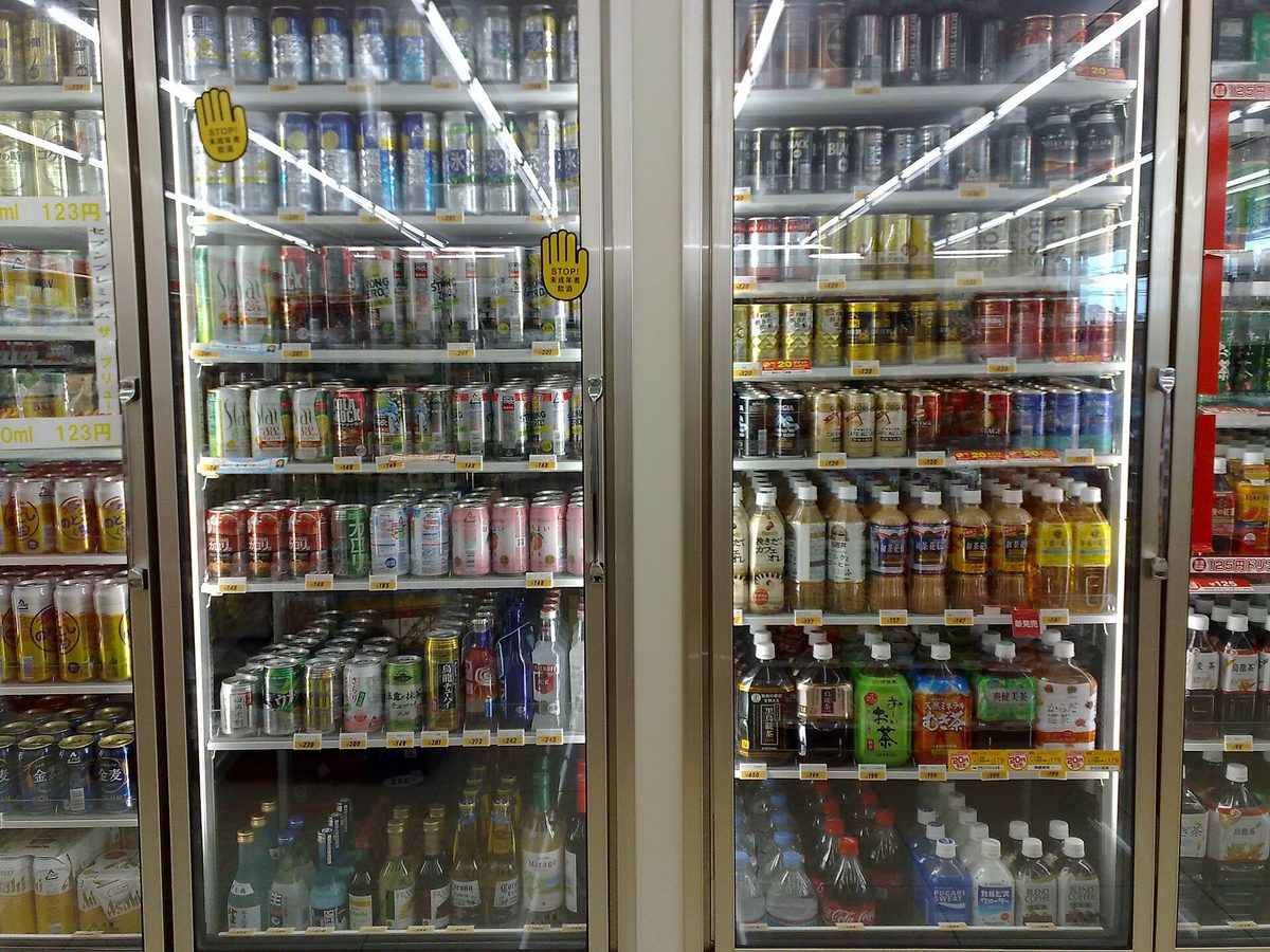 Glass-door fridges full of drinks in a Japanese convenience store