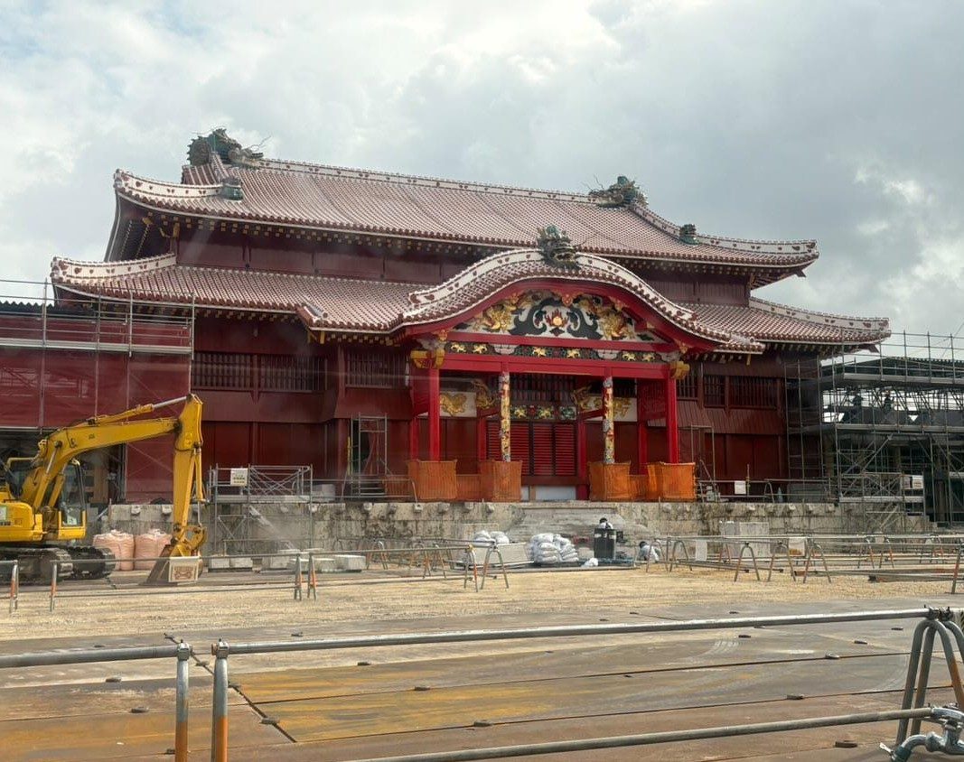 The red main hall of Shuri Castle nearly finished, with a construction fence in front, Naha (Okinawa)